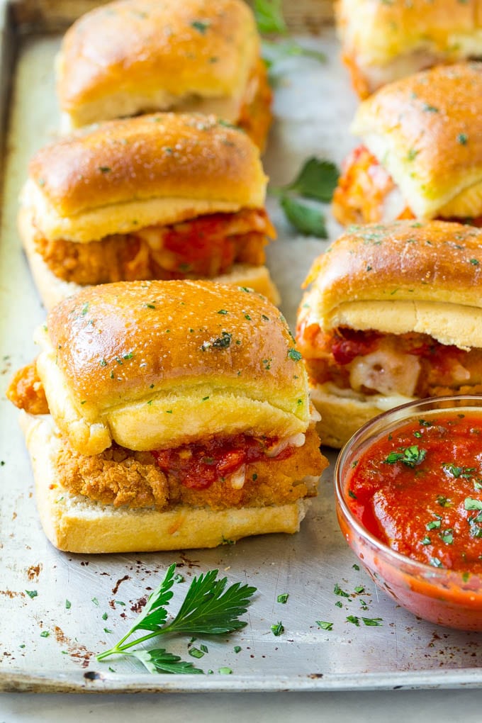 Chicken Parmesan Sliders | Chicken Parmesan Sandwich Recipe | Slider Sandwich Recipe #sliders #chickenparm #chickenparmesan #chickenparmesansliders #dinner #appetizer #dinneratthezoo Chicken parmesan sliders made with crispy chicken, marinara sauce and cheese on buns.